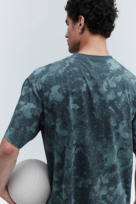 HM Sportshirt aus DryMove™ in Loose Fit Exklusivangebot